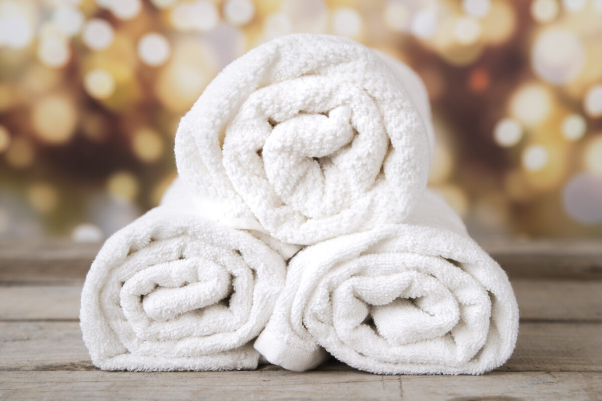 front-view-stacked-towels-with-bokeh-background