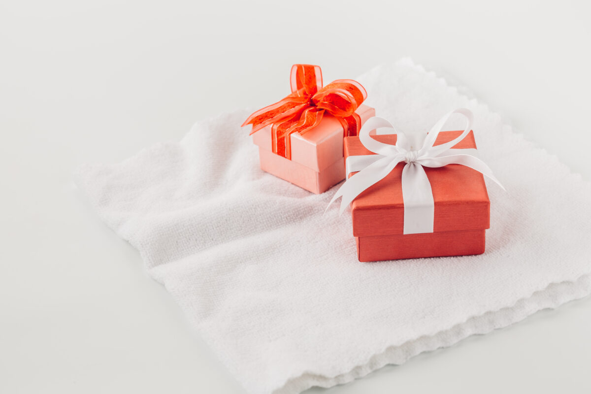 red-gift-box-white-towel-background